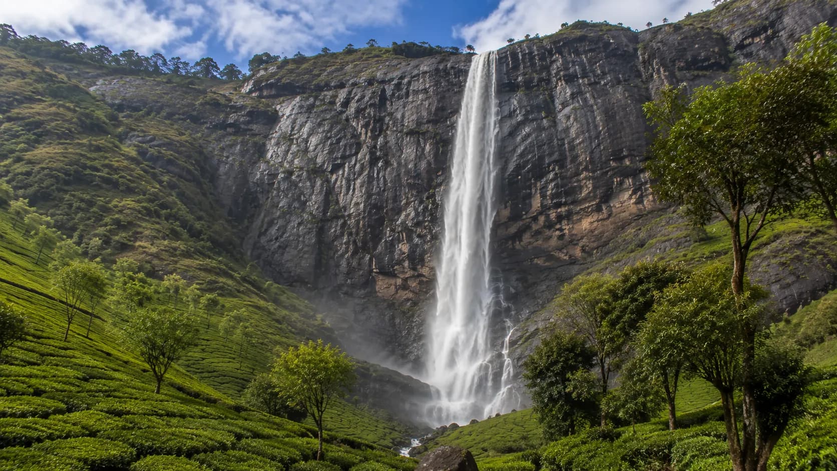 Nyayamakad Waterfalls cascading down a granite cliff in Munnar