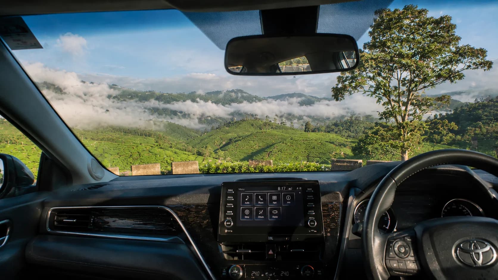 Scenic mountain highway drive through Munnar tea gardens